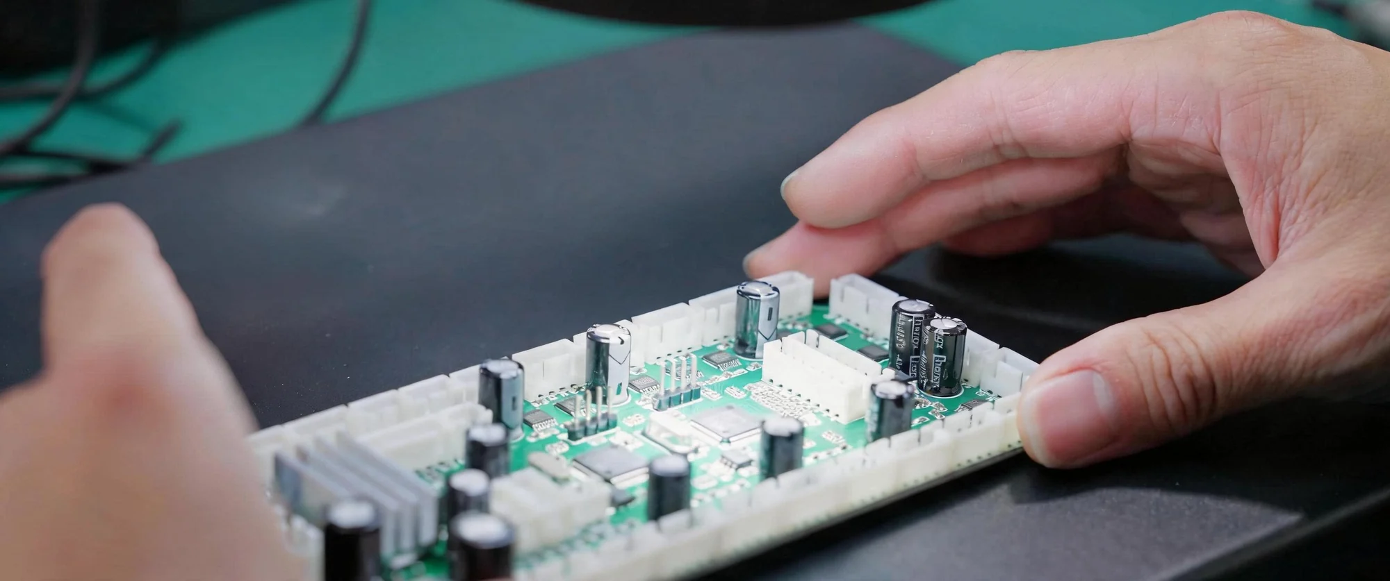 Hengmei technician inspecting a lighting circuit board